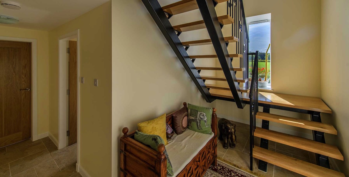 converted steading showing new wooden stair case with windows in a residential property in Aberdeenshire