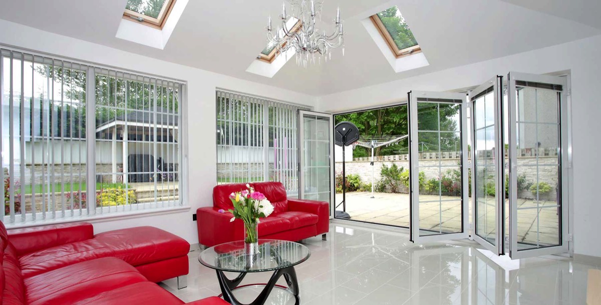 Modern and bright living room extension with bi-folding doors
