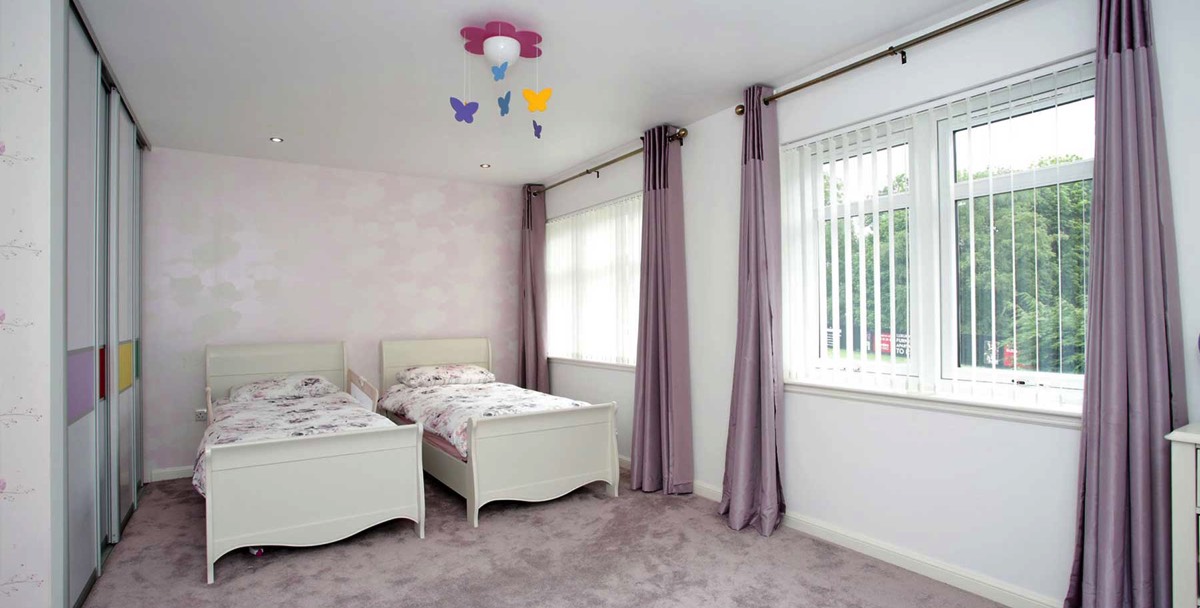 Beautifully decorated white and purple children’s bedroom