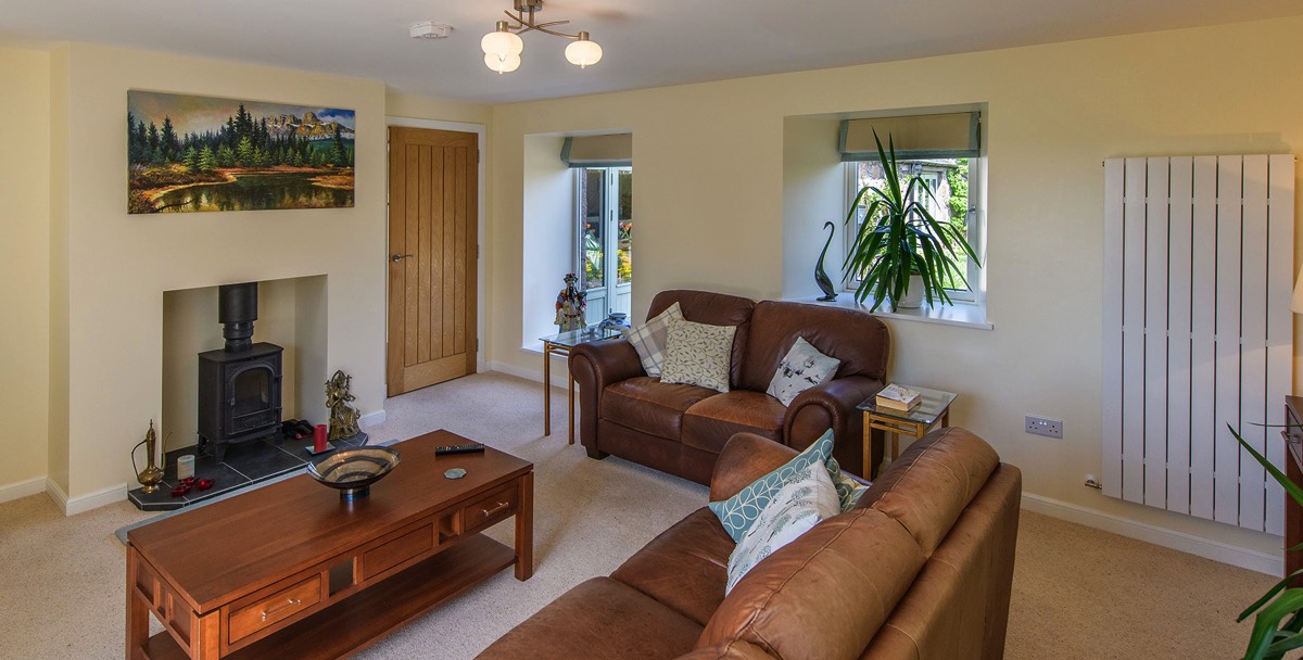 recently refurbished living room area with wood burning stove in Aberdeenshire